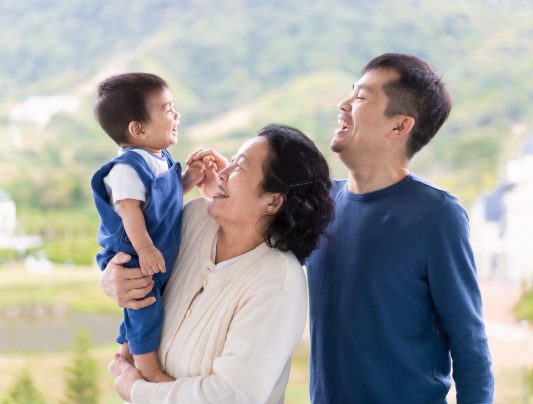 asian-grandmother-is-holding-the-little-baby-boy-g-2024-11-27-09-48-05-utc
