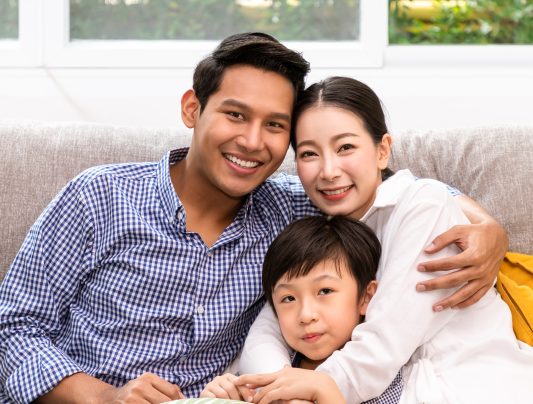 happy-asian-family-on-sofa-in-living-room-includi-2025-10-30-21-12-30-utc